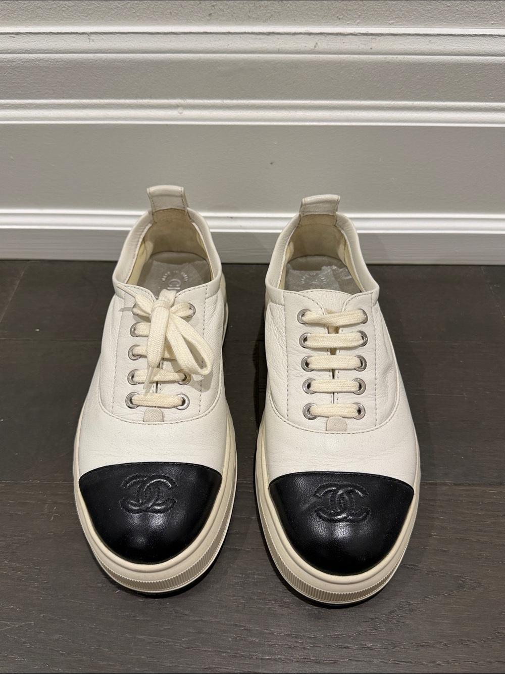 CHANEL White Leather Sneakers with Black Cap Toe